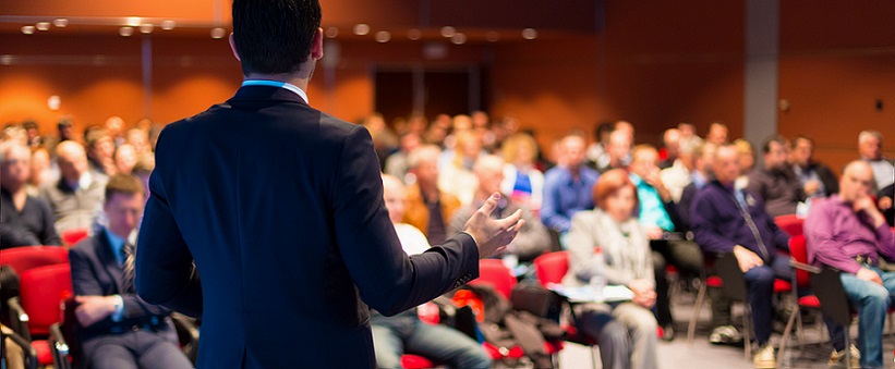 man speaking to audience